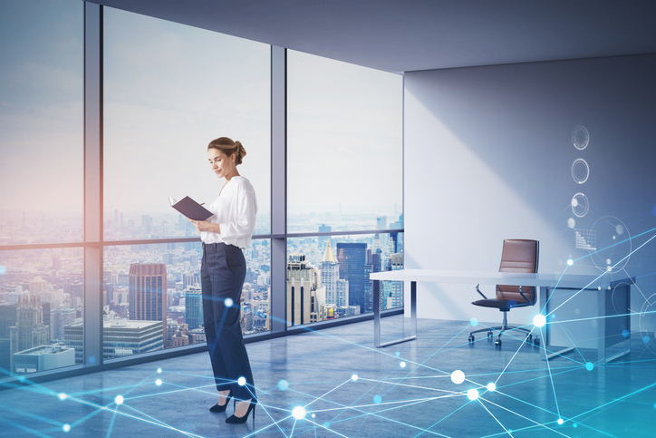 Woman in office using a tablet